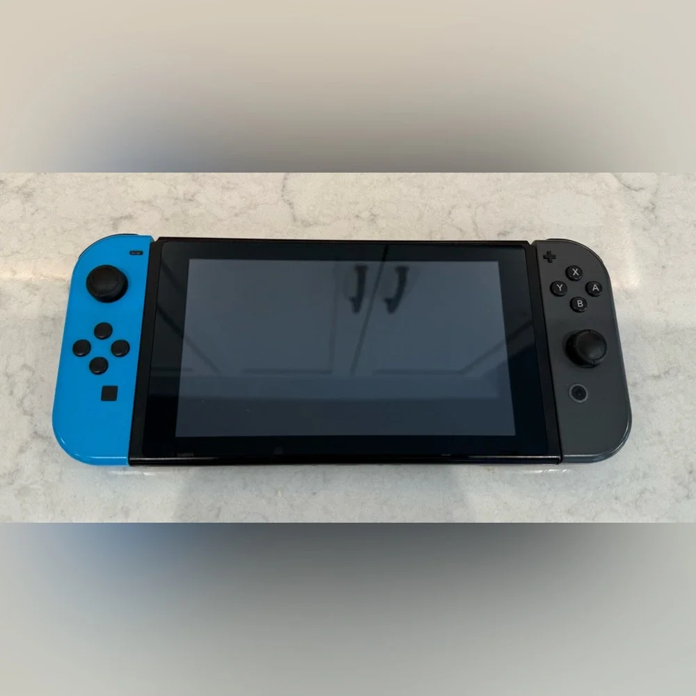 Nintendo Switch Console w/ Game, Case, Dock, and Joy-Cons.
